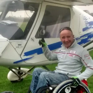 Adult Taking Part In Accessible Flying Lessons