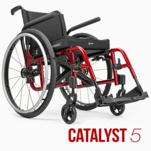 Ki Mobility Catalyst 5 wheelchair with red frame, angled view.