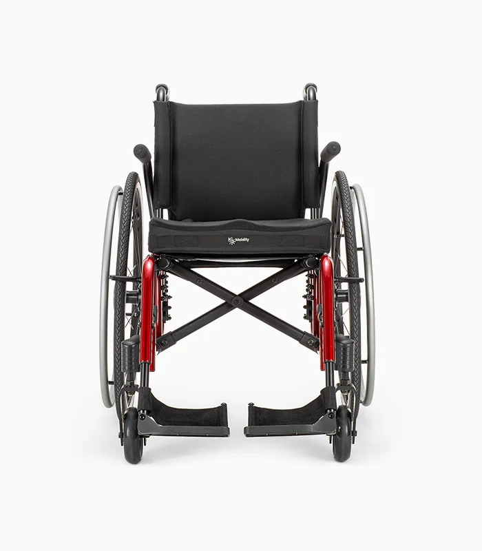 Ki Mobility Catalyst wheelchair with red frame, front view.