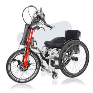 TriBike handcycle attachment with red fork and hand-crank pedals, connected to a manual wheelchair.