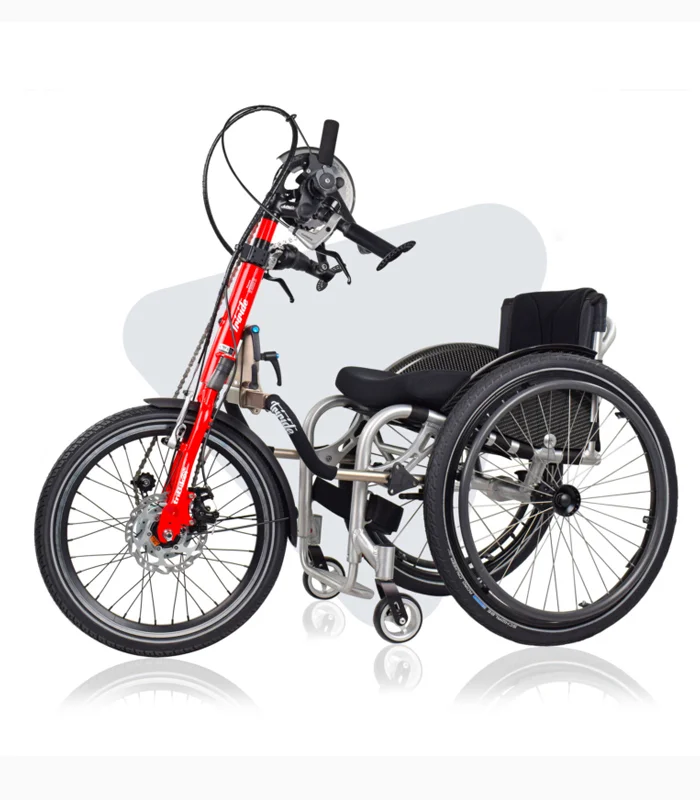TriBike handcycle attachment with red fork and hand-crank pedals, connected to a manual wheelchair.