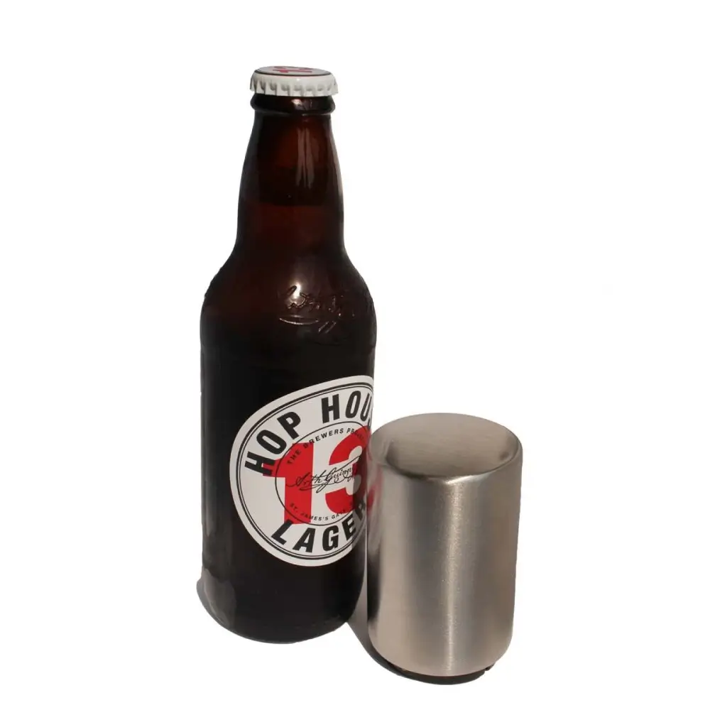 Automatic Bottle Opener Next To A Glass Bottle