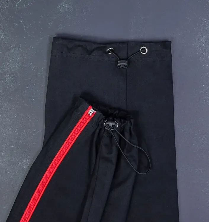 Close-Up Of Black Cotton Adapted Cargo Trousers at the Ankle and Hem