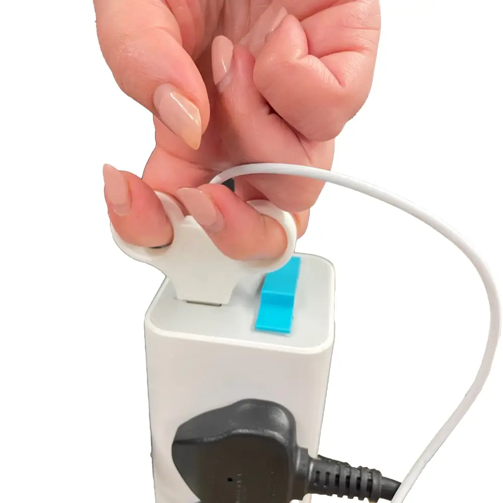 Adult Pulling Cable Out Of Power Brick Cable Puller
