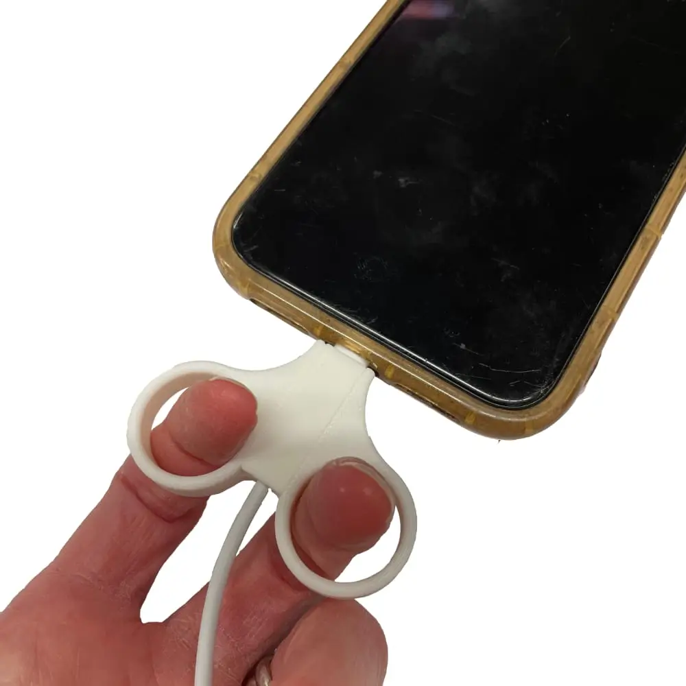 Adult Pulling Cable Out Of iPhone Cable Puller