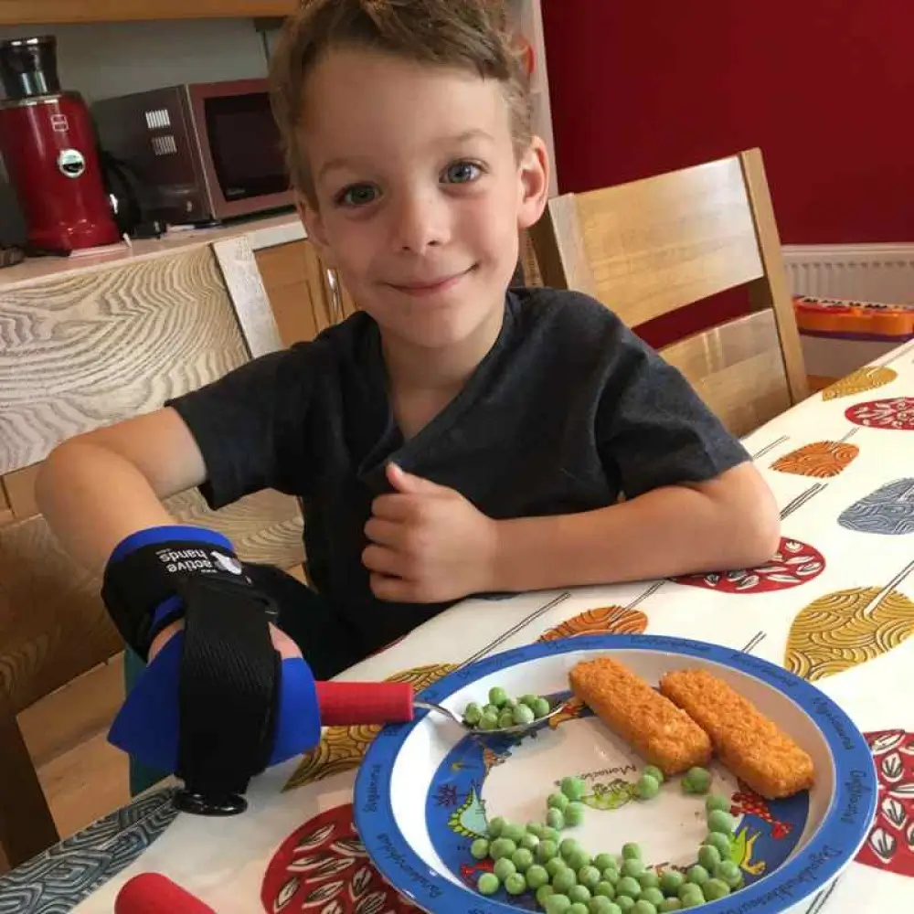 Child Using Active Hands Childrens Cutlery Grips