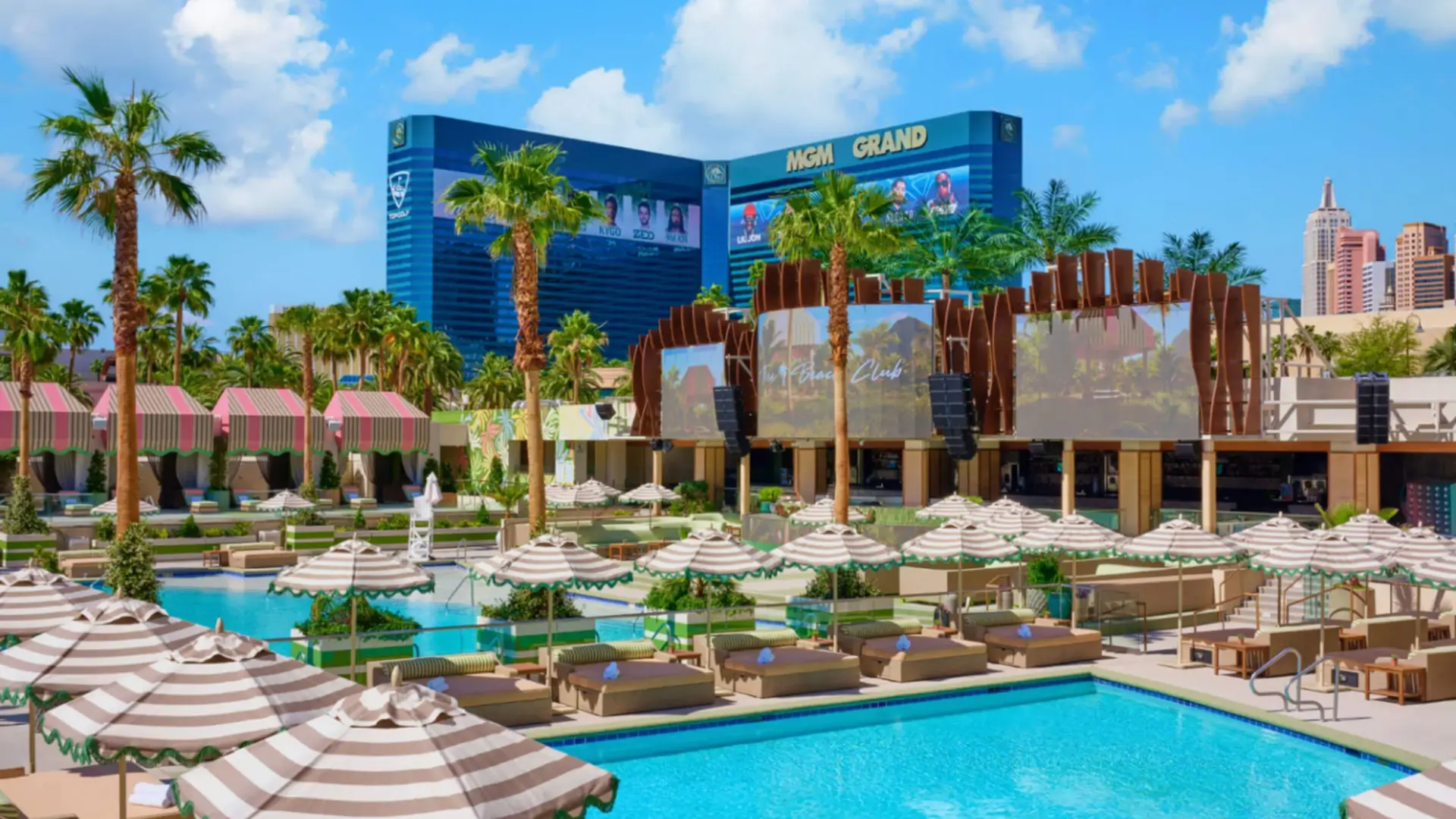 Pool club with umbrellas and MGM Grand in background.