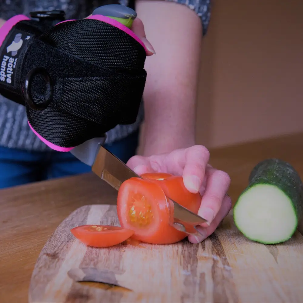 An Easi Grip Knives Cutting Tomatoes