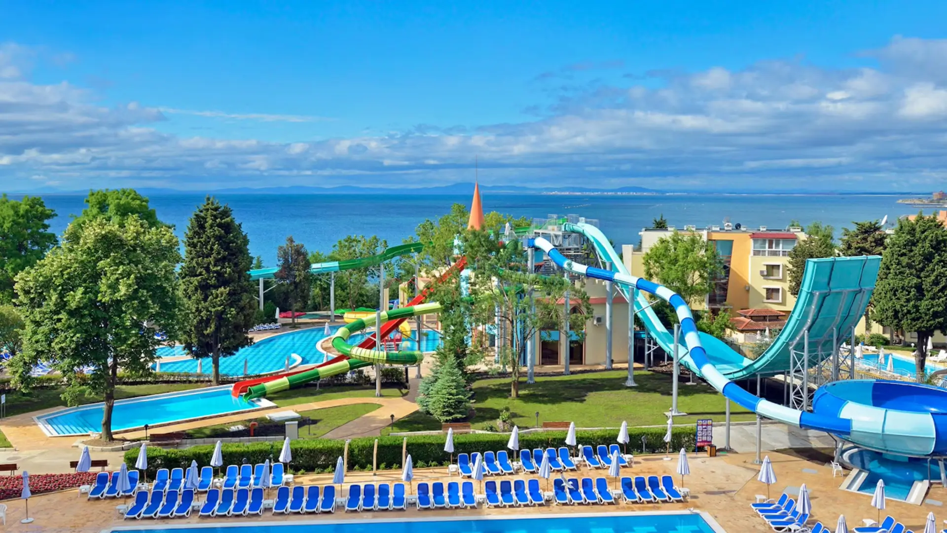 Water park with slides overlooking the sea.