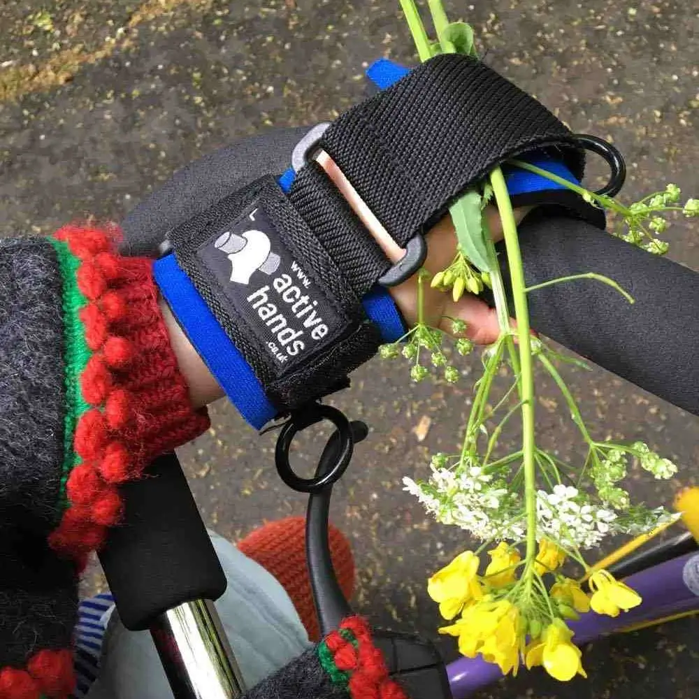 Close Up Of Child Riding Bike Using The General Purpose Mini Aid