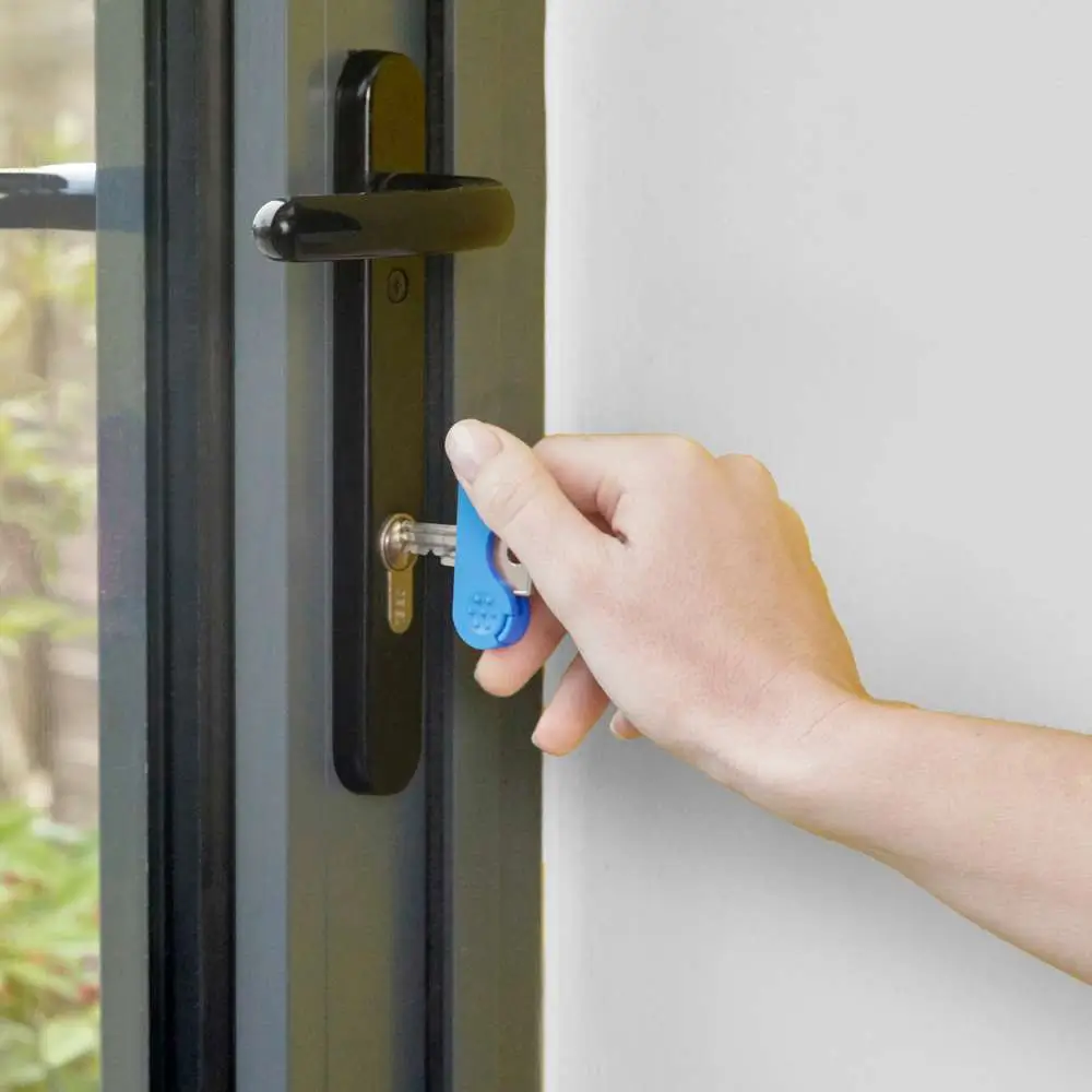 Adult Using Active Hands Keywings To Open Door