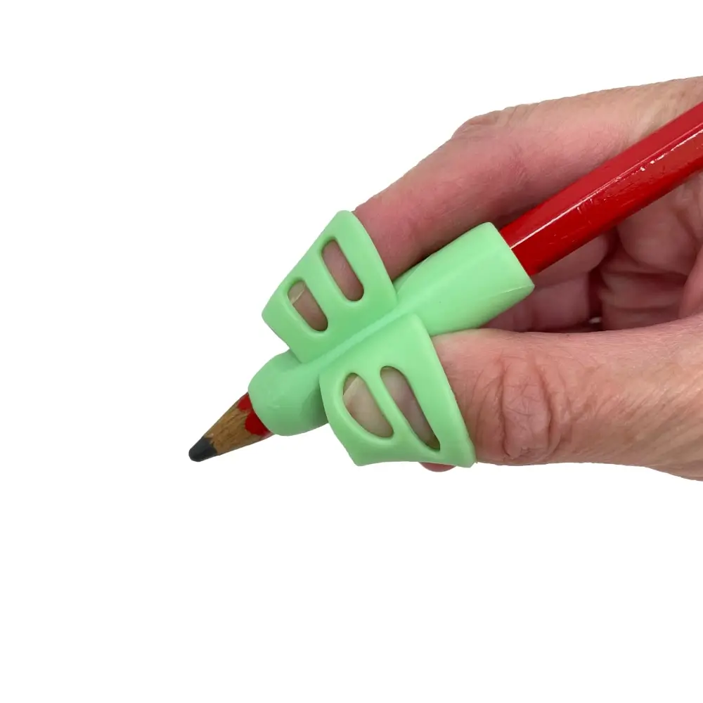 Child Using The Pencil Finger Grips