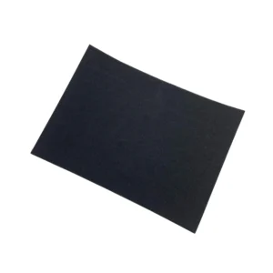 Flat black foam sheet lying on a white background.