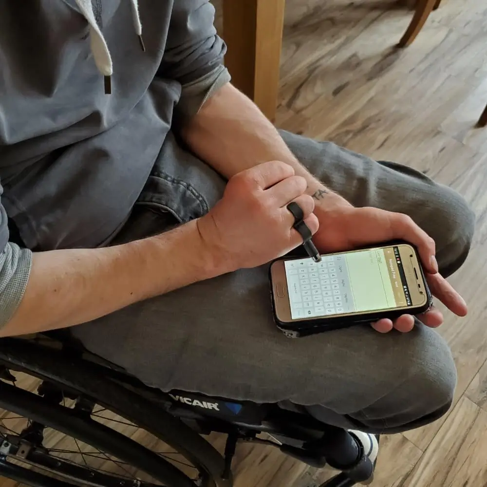 Adult Using Sixth Digit 2 On His Phone
