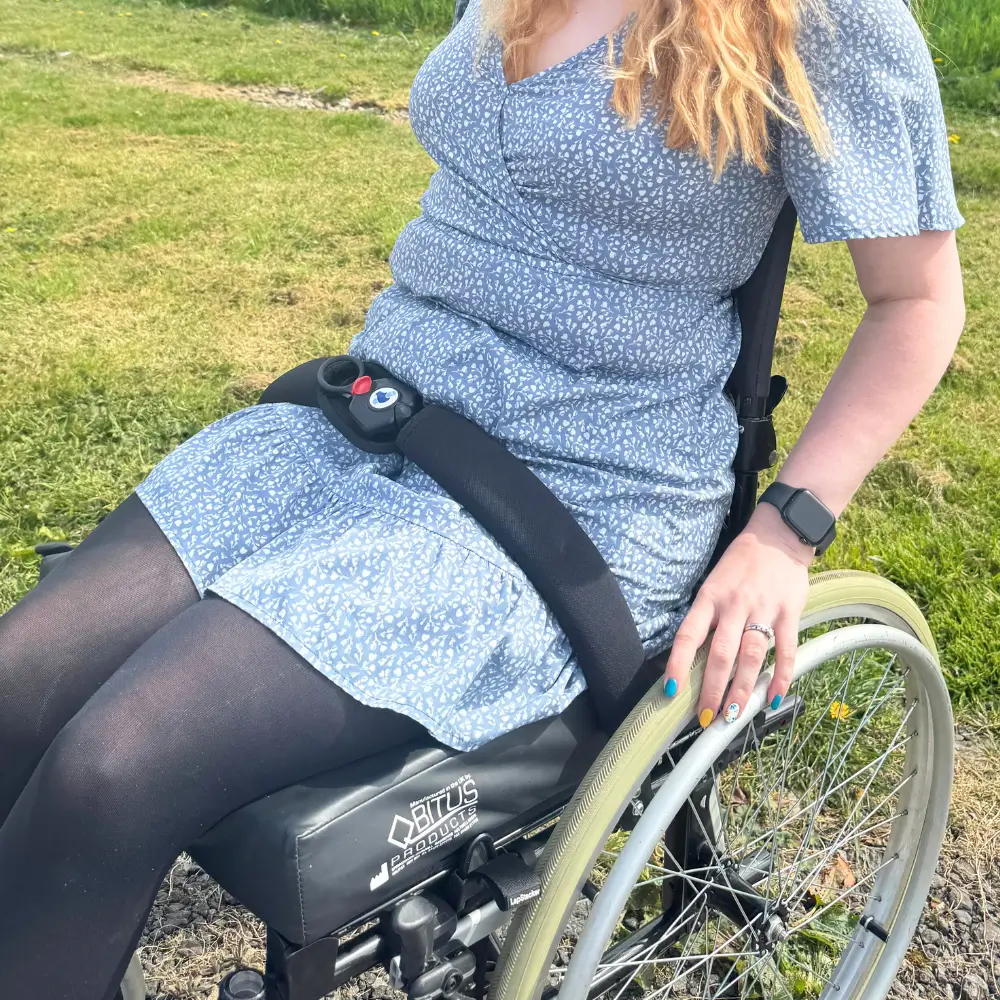 Adult Wearing The Soloc Freedom Wheelchair Lap Belt