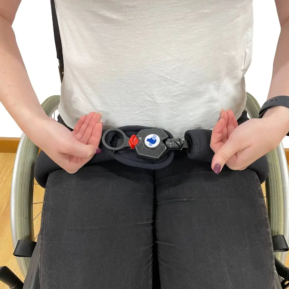 Adult Showing The Connection Of The Soloc Freedom Wheelchair Lap Belt