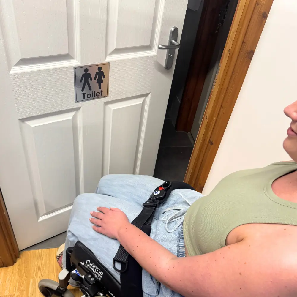 Adult Wearing Soloc Uno Wheelchair Accessory