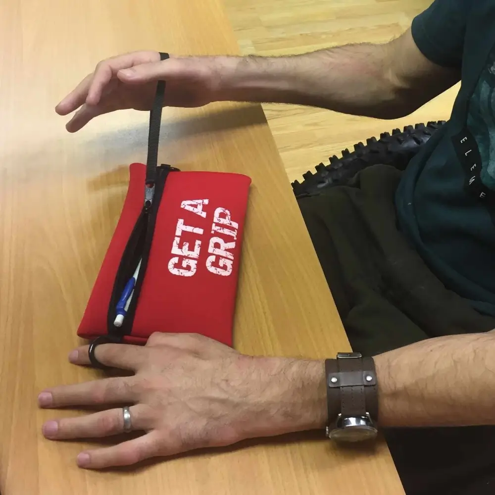 Person Opening Active Hands Storage Pouch