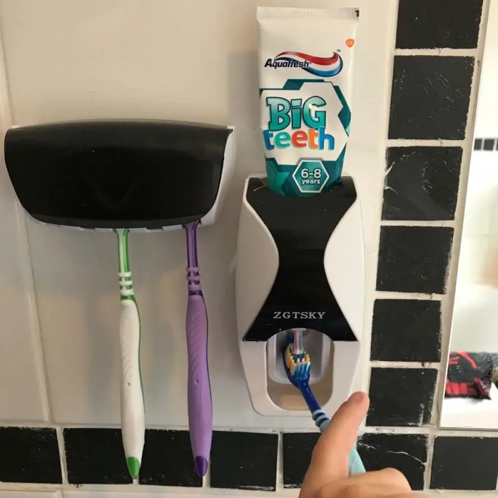 Child Using Toothpaste Dispenser