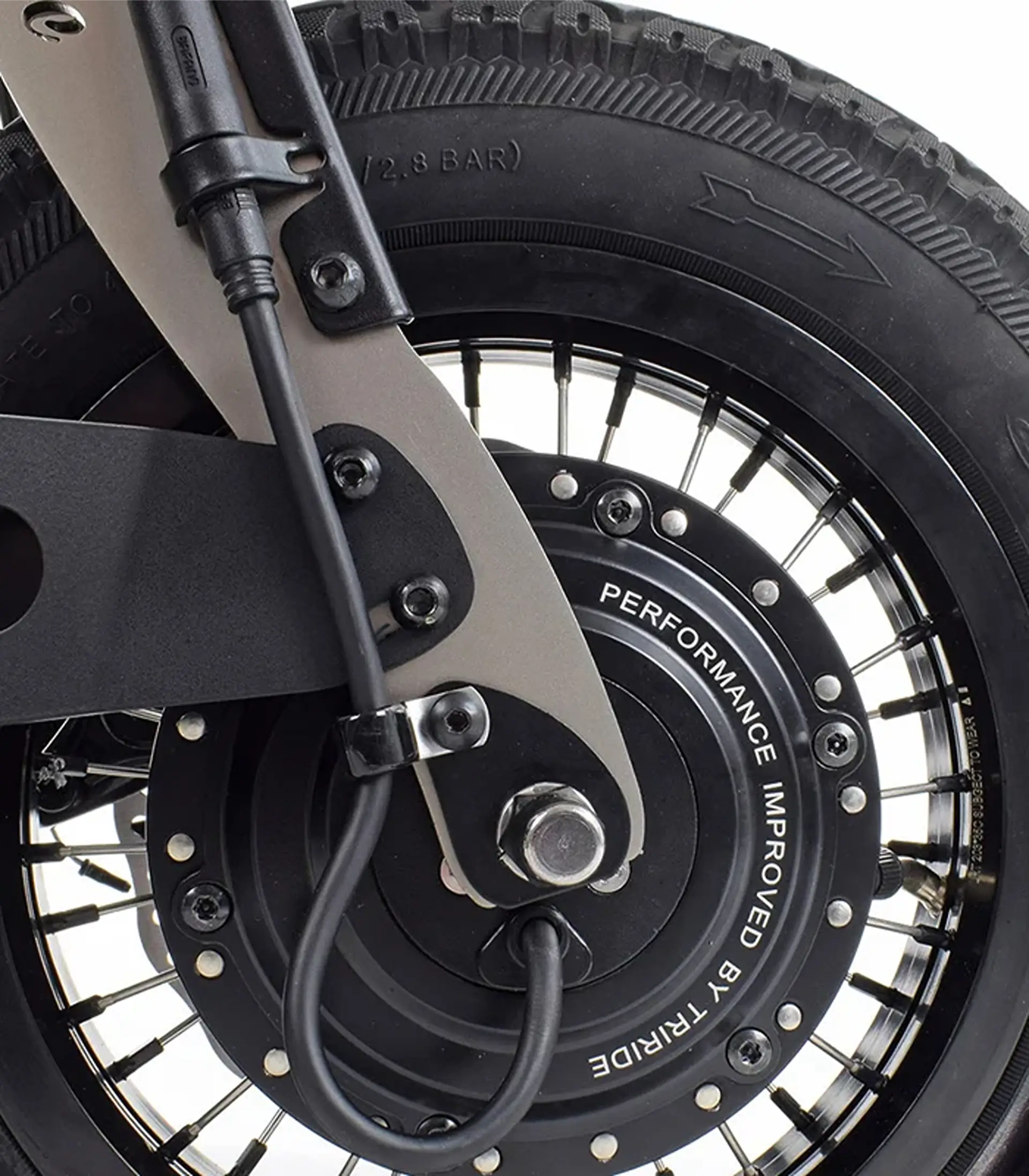 Close-up of the Triride Light's front hub motor with "Performance Improved by Triride" engraving.