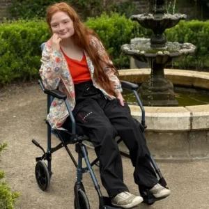 Adult Using a Wheelchair Wearing Waterproof Black Cotton Adapted Cargo Trousers