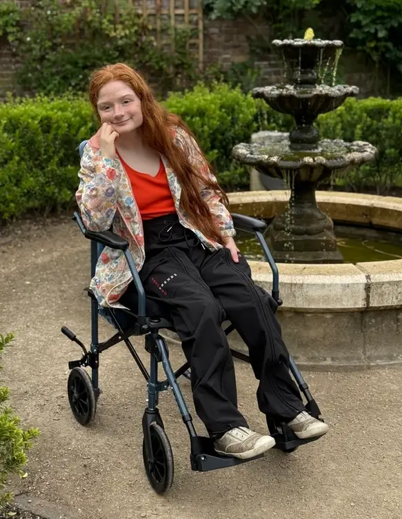 Adult Using a Wheelchair Wearing Waterproof Black Cotton Adapted Cargo Trousers