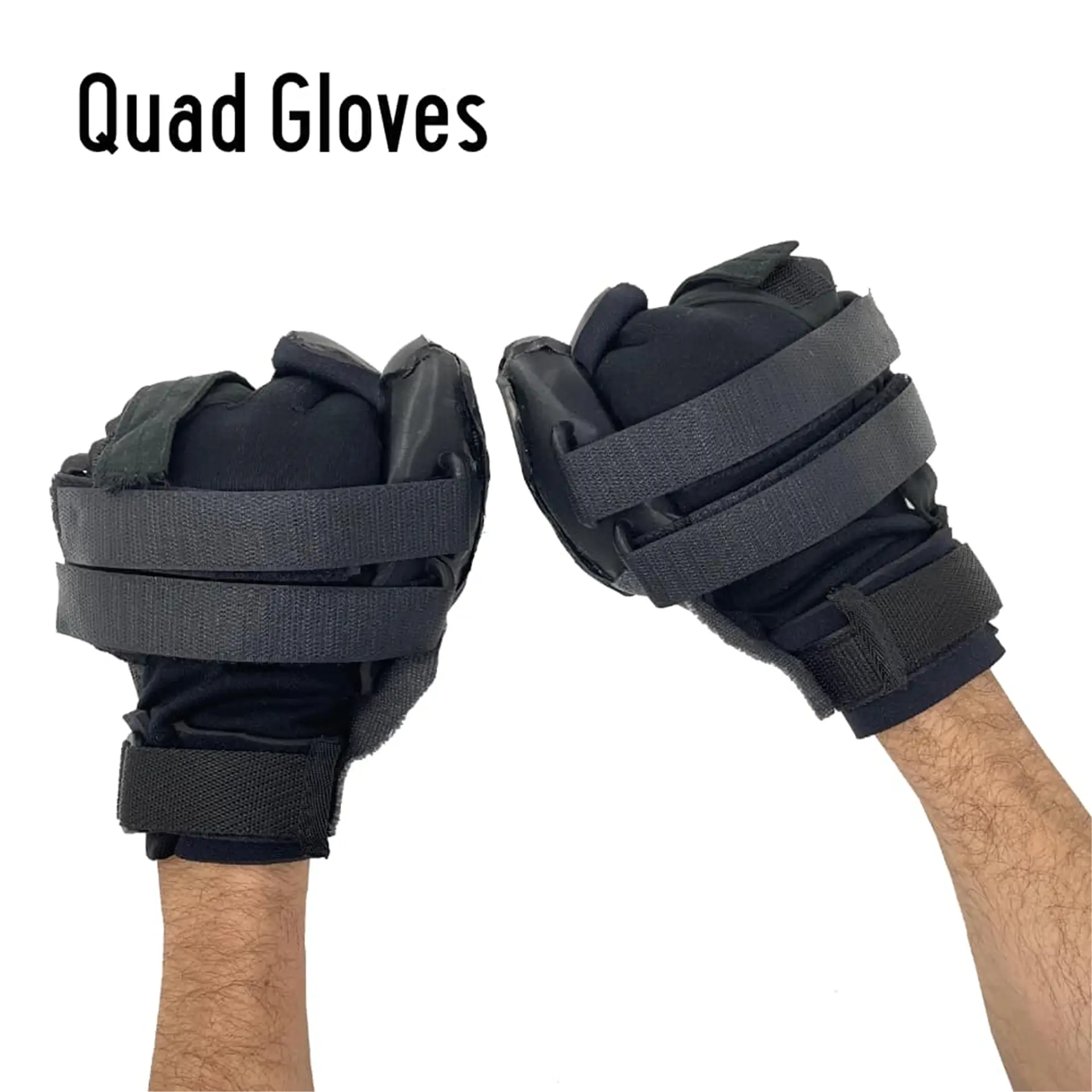Pair of black padded Quad Gloves on raised fists, labeled with product name.