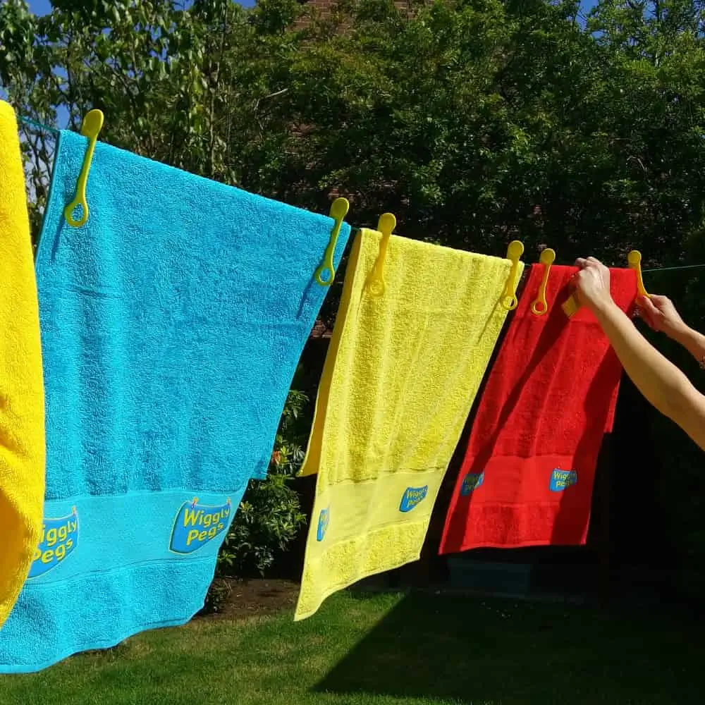 Multiple Different Towels Kept on Laundry Line By Wiggly Pegs