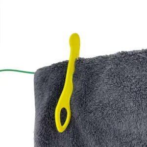 Close Up Of Wiggly Pegs On Towel