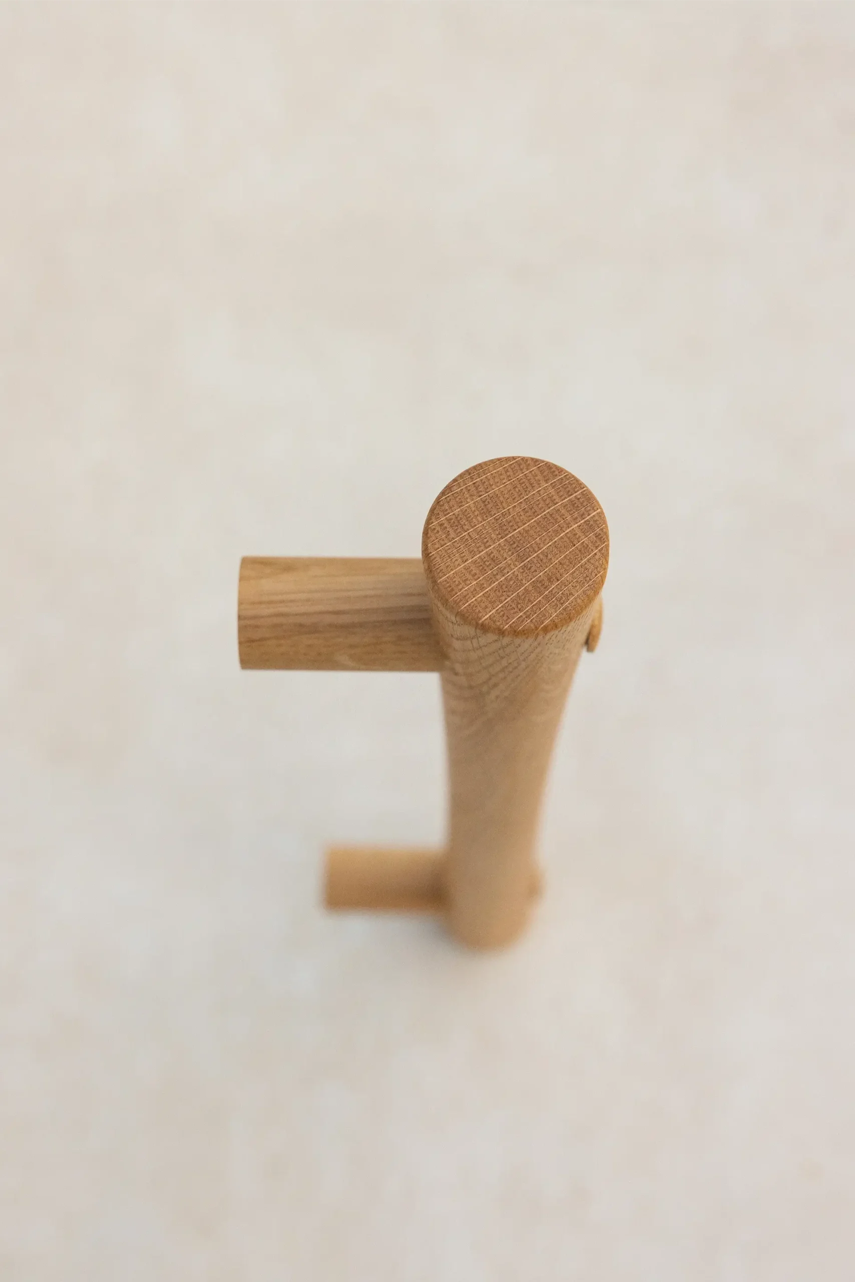 Overhead detail of an oak grab rail's mounting post.