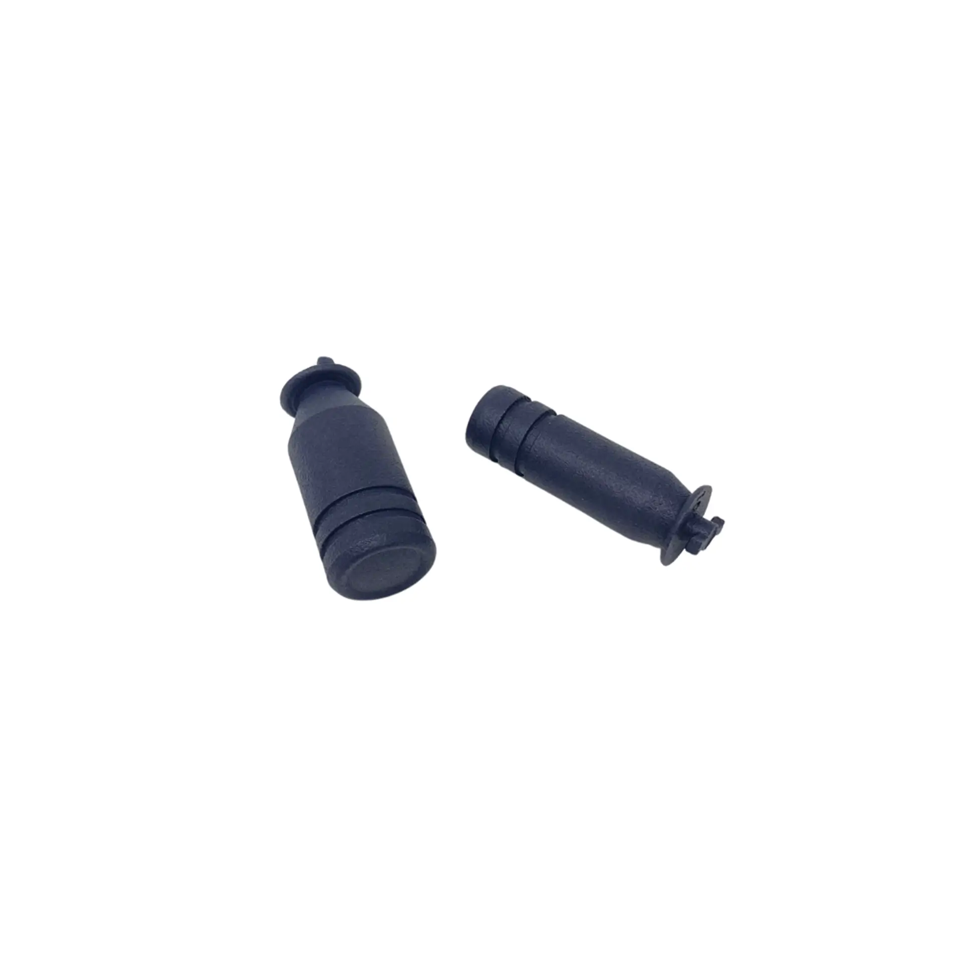 Two tall cylindrical controller stick extenders.