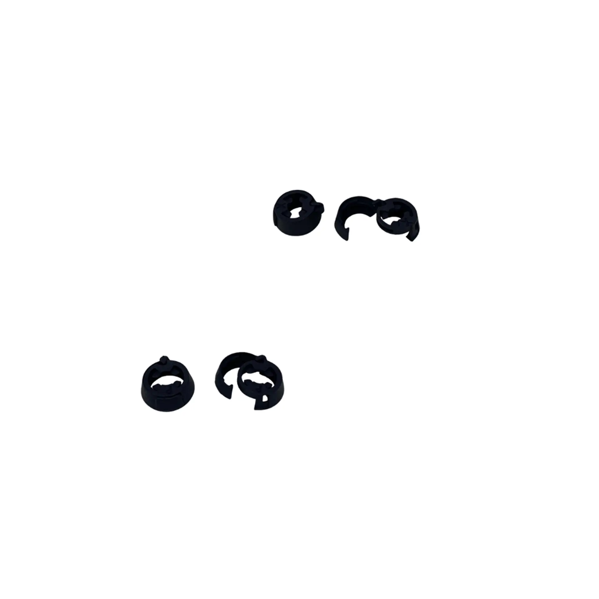 Four black knuckle-style controller ring attachments.