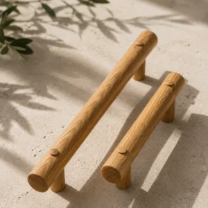 Two oak grab rails standing on sand with olive leaves overhead.