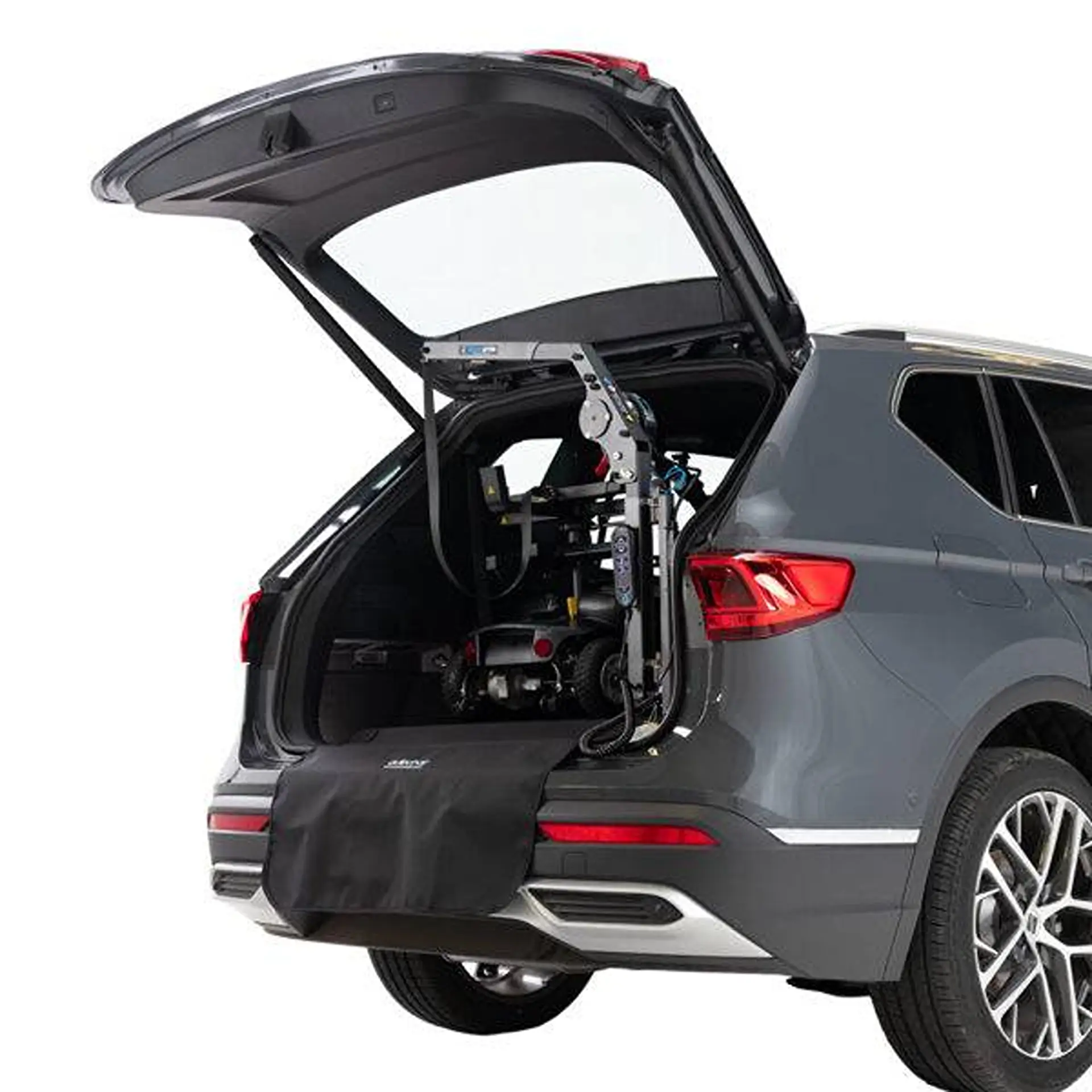 Similar view of the folded lifter arm and boot cover in an SUV.