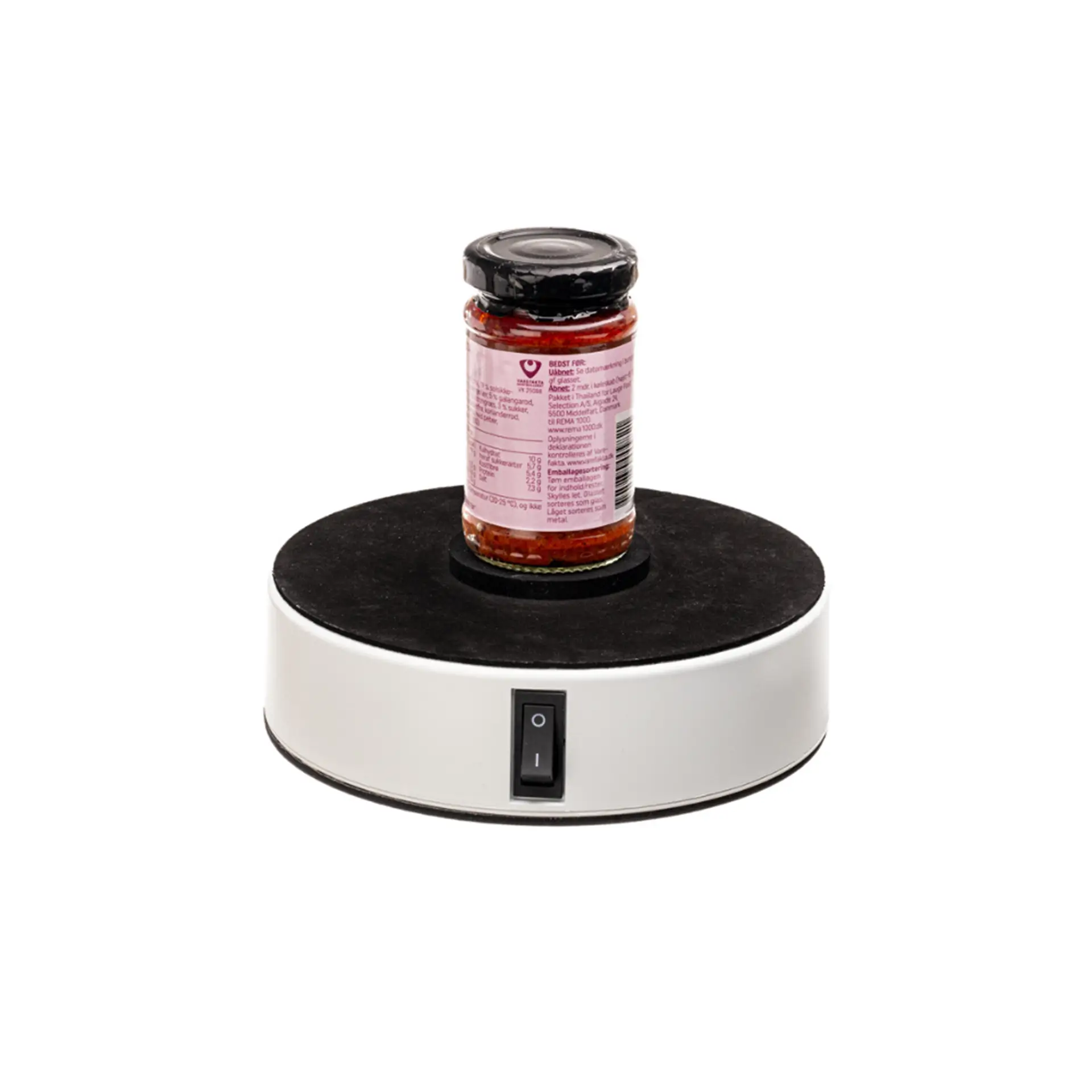Jar on rotating turntable base with power switch.
